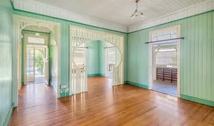 queenslander cottage interior timber floors decorative archways